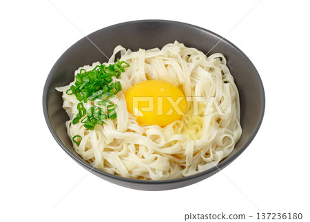 Udon noodles with raw egg and green onion isolated on white background with clipping path 137236180