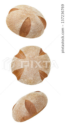 Breads dark round rye, sprinkled with semolina falling, hanging, flying, soaring isolated on white background Breads dark round rye, sprinkled with semolina falling, hanging, flying, soaring isolated on white background 137236769
