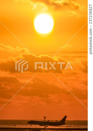 Sunset and airplane 137236827