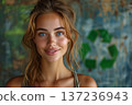 Attractive Woman Smiling Near Recycling Symbol Wall 137236943