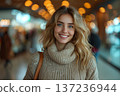 Smiling Woman In Beige Sweater At Shopping Mall 137236944