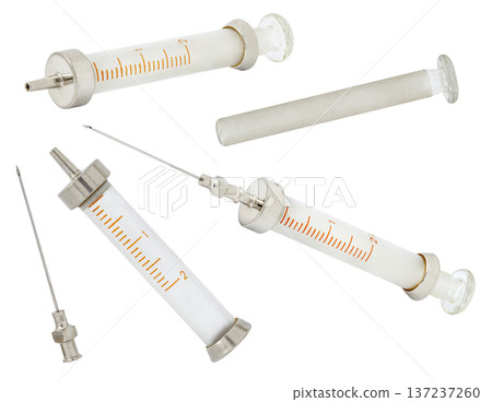 Old glass syringes, disassembled and needles, set, isolated on white background Old glass syringes, disassembled and needles, set, isolated on white background 137237260