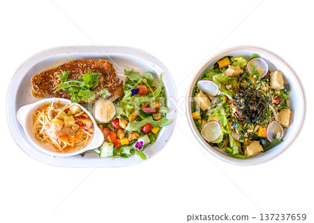 Top view of Vegetable salad fried sea bass and papaya salad, focus selective Top view of Vegetable salad fried sea bass and papaya salad, focus selective 137237659