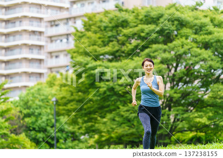 Middle woman jogging Middle woman jogging 137238155