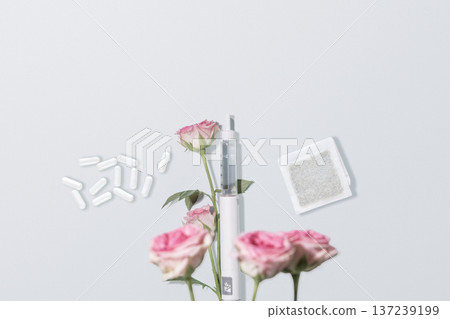 GLP Therapy Concept With Injection Pen, Capsules And Pink Carnations GLP Therapy Concept With Injection Pen, Capsules And Pink Carnations 137239199
