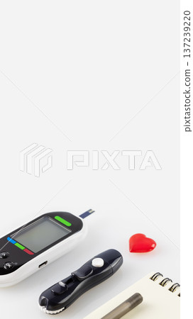Blood Glucose Meter With Lancet Pen And Red Heart On Light Background 137239220