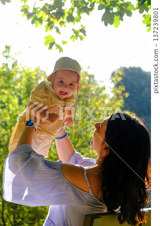 Mother and Baby Enjoying a Sunny Day in the Park 137239801
