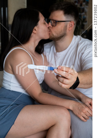 Happy Couple Celebrating Positive Pregnancy Test Happy Couple Celebrating Positive Pregnancy Test 137239802
