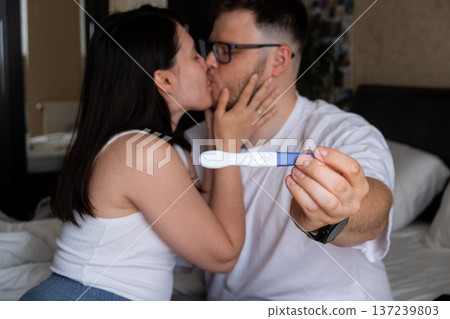 Happy Couple Celebrating Positive Pregnancy Test Happy Couple Celebrating Positive Pregnancy Test 137239803