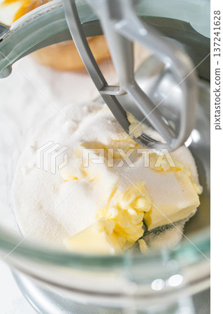 Mixer bowl with butter and sugar, ready to be combined in preparation for making Pale Gingerbread Cookies. Early steps in the recipe. 137241628