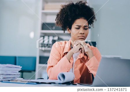Businesswoman get stressed and headache while having a problem at work in office Businesswoman get stressed and headache while having a problem at work in office 137241871