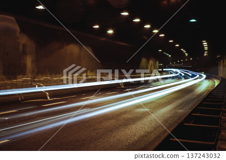 city lights long exposure street life in the city speed highway white and red lights environment cars speed in a tunnel city lights long exposure street life in the city speed highway white and red lights environment cars speed in a tunnel 137243032