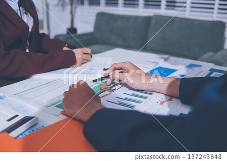 Accounting company provide finance and taxation planning for profitable cash flow, Auditor and accountant team working in office, analyze financial data and accounting record with calculator 137243848
