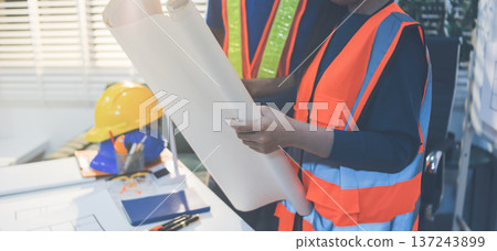 Concept Architect and desk of Architectural project in construction site or office building with mining light Concept Architect and desk of Architectural project in construction site or office building with mining light 137243899
