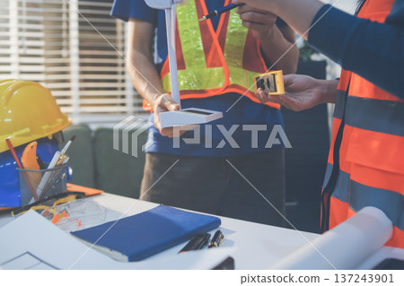 Concept Architect and desk of Architectural project in construction site or office building with mining light Concept Architect and desk of Architectural project in construction site or office building with mining light 137243901