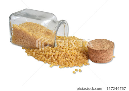 Couscous in a glass container. Couscous in a glass container. 137244767