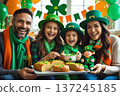 Happy family celebrating St. Patrick's Day. 137245185