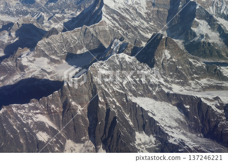 Himalayan mountain ranges seen from a mountain flight airplane window Himalayan mountain ranges seen from a mountain flight airplane window 137246221