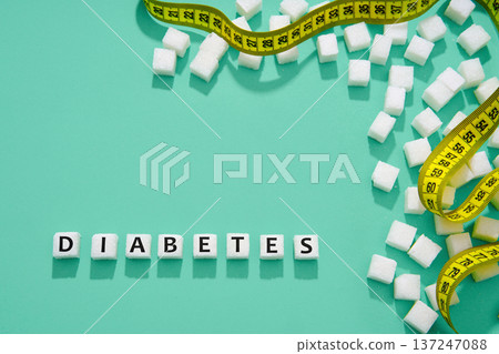 Diabetes concept with sugar and measuring tape Diabetes concept with sugar and measuring tape 137247088