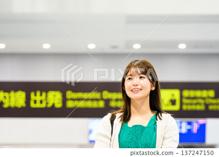 A woman waiting to depart at the airport. Photo courtesy of Kansai International Airport (KIX) A woman waiting to depart at the airport. Photo courtesy of Kansai International Airport (KIX) 137247150