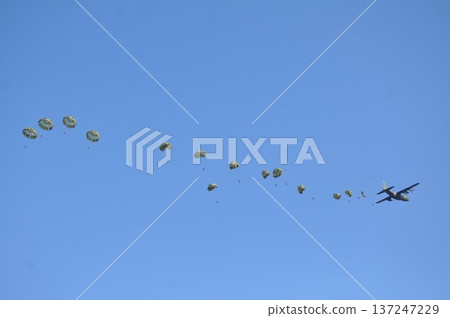 A soldier parachuting from a military aircraft 137247229