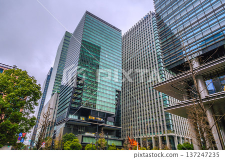 Dark clouds over the Tokyo cityscape in Japan... Japan's economy is depressed... Otemachi is in the rain... = March 3, 2026 137247235