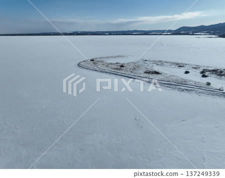 Aerial photo of Lake Saroma and Cape Kimuaneppu snow fields in winter 137249339