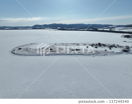 Aerial photo of Lake Saroma and Cape Kimuaneppu snow fields in winter 137249340