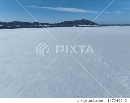 Aerial photo of Lake Saroma and Cape Kimuaneppu snow fields in winter 137249342