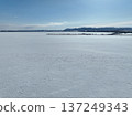 Aerial photo of Lake Saroma and Cape Kimuaneppu snow fields in winter 137249343