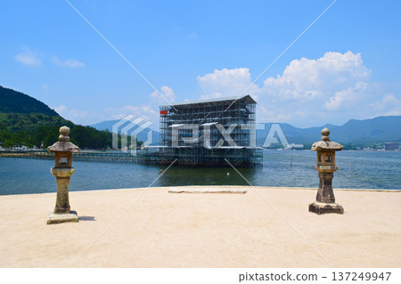 The great torii gate of Itsukushima Shrine under preservation and repair work. A rare sight at high tide The great torii gate of Itsukushima Shrine under preservation and repair work. A rare sight at high tide 137249947