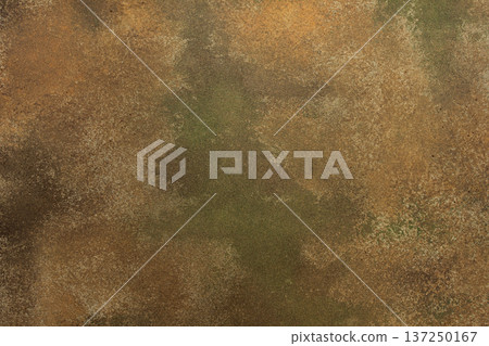 A textured surface with worn coloring appears in the frame. Ochre, green, tan, and brown shades mix to create an abstract design with a rugged feel A textured surface with worn coloring appears in the frame. Ochre, green, tan, and brown shades mix to create an abstract design with a rugged feel 137250167