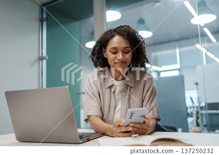 Focused Female Professional Organizes And Communicates Efficiently Within Stylish Office Space Focused Female Professional Organizes And Communicates Efficiently Within Stylish Office Space 137250232