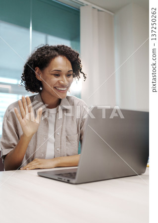 Woman Demonstrates Slide Details Confidently. Speaker Gestures Toward Computer During Discussion Woman Demonstrates Slide Details Confidently. Speaker Gestures Toward Computer During Discussion 137250262