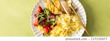 A nutritious and balanced breakfast with millet, baked chicken breast, a fresh salad with greens and grapefruit, providing protein, fiber, and vitamins for energy, banner A nutritious and balanced breakfast with millet, baked chicken breast, a fresh salad with greens and grapefruit, providing protein, fiber, and vitamins for energy, banner 137250977