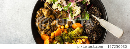 A vibrant, protein-packed breakfast with black quinoa, avocado, chicken, roasted veggies like sweet potato, broccoli, and a fresh salad of cabbage, radish, chia, and sesame seeds, banner A vibrant, protein-packed breakfast with black quinoa, avocado, chicken, roasted veggies like sweet potato, broccoli, and a fresh salad of cabbage, radish, chia, and sesame seeds, banner 137250980