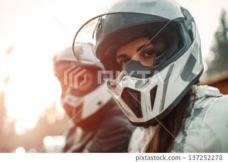 modern biker couple in full protective gear preparing for ride near mountain lodge, travel and 137252278