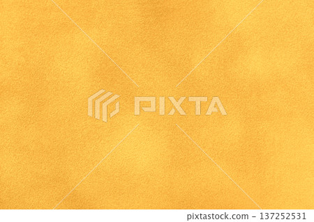 Yellow suede fabric background with matte nap velvet texture. Golden tones and soft felt textile surface in macro Yellow suede fabric background with matte nap velvet texture. Golden tones and soft felt textile surface in macro 137252531