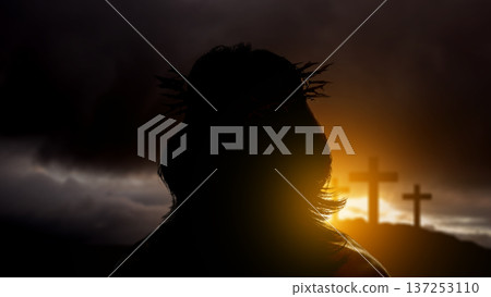 Dramatic silhouette of Jesus Christ wearing a crown of thorns, looking towards three crosses on hill during a golden sunset. Powerful symbolic representation of the crucifixion, faith, and redemption Dramatic silhouette of Jesus Christ wearing a crown of thorns, looking towards three crosses on hill during a golden sunset. Powerful symbolic representation of the crucifixion, faith, and redemption 137253110
