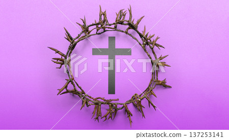 Brown crown of thorns encircling a black cross on a purple textured background. This image represents the passion of Christ, suitable for Lent, Good Friday, and Easter religious themes 137253141
