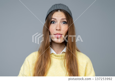 Waist up of a cute young woman having fun and feeling naughty 137253992