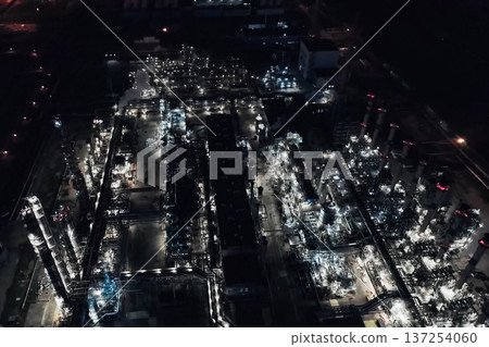 Oil refinery at night lit. Construction of an oil industrial fac 137254060