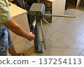 Testing turnstile at the entrance. Pass through the turnstile. 137254113