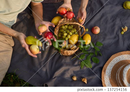 Casual outdoor gathering featuring fresh fruits and joyful conversation Casual outdoor gathering featuring fresh fruits and joyful conversation 137254156