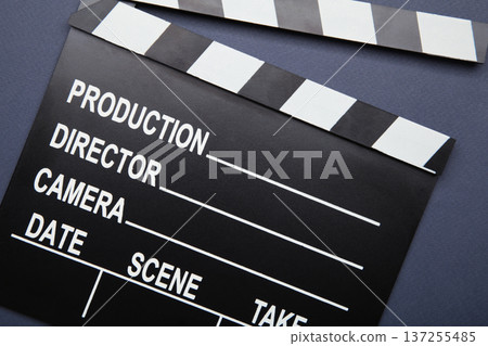 One movie clapper on dark blue background. Film industry One movie clapper on dark blue background. Film industry 137255485