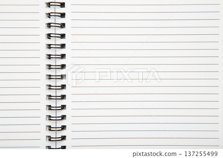 Macro shot of a black metal double-wire spiral binding on white notebook. Macro shot of a black metal double-wire spiral binding on white notebook. 137255499