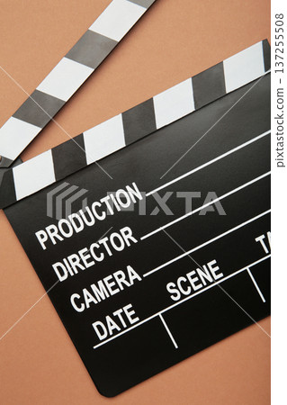 One movie clapper on brown background. Film industry One movie clapper on brown background. Film industry 137255508