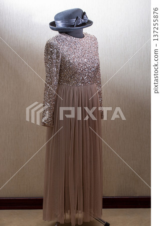 A beautiful women's dress on a mannequin with a hat A beautiful women's dress on a mannequin with a hat 137255876