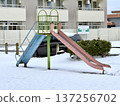 Snow-covered park slide 137256702