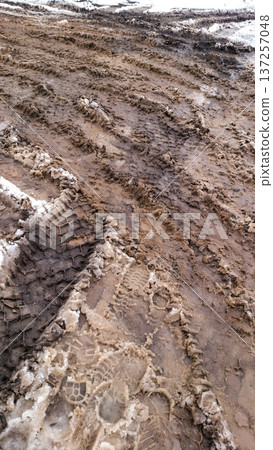 Sidewalk. Melting snow on the ground. Sidewalk. Melting snow on the ground. 137257048